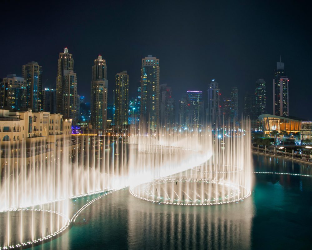 DUBAI UAE 31 JANUARY 2017 famous musical fountain in Dubai with skyscrapers in the background on a beautiful summer evening